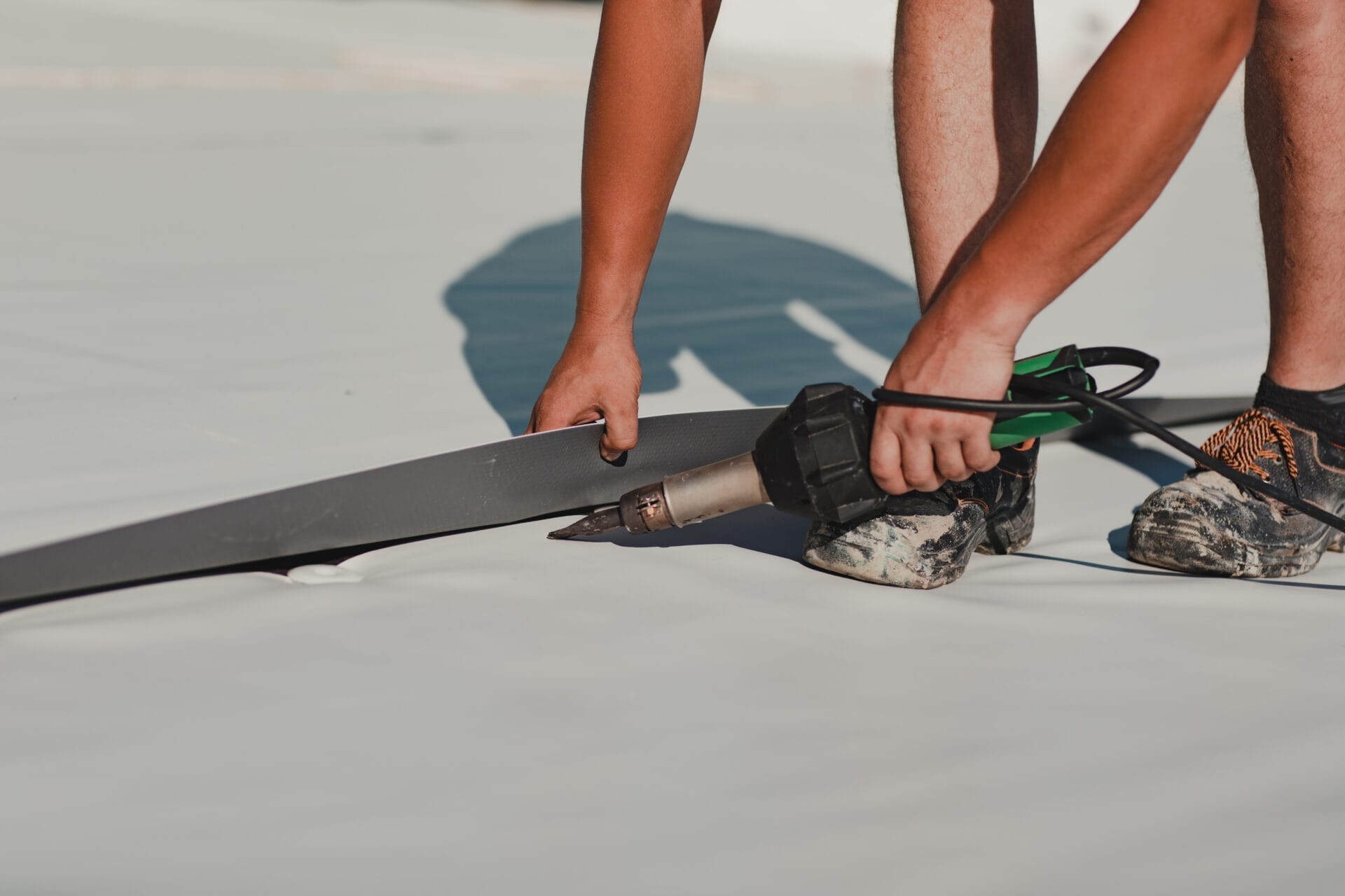 a person repairing a roof with special machinery