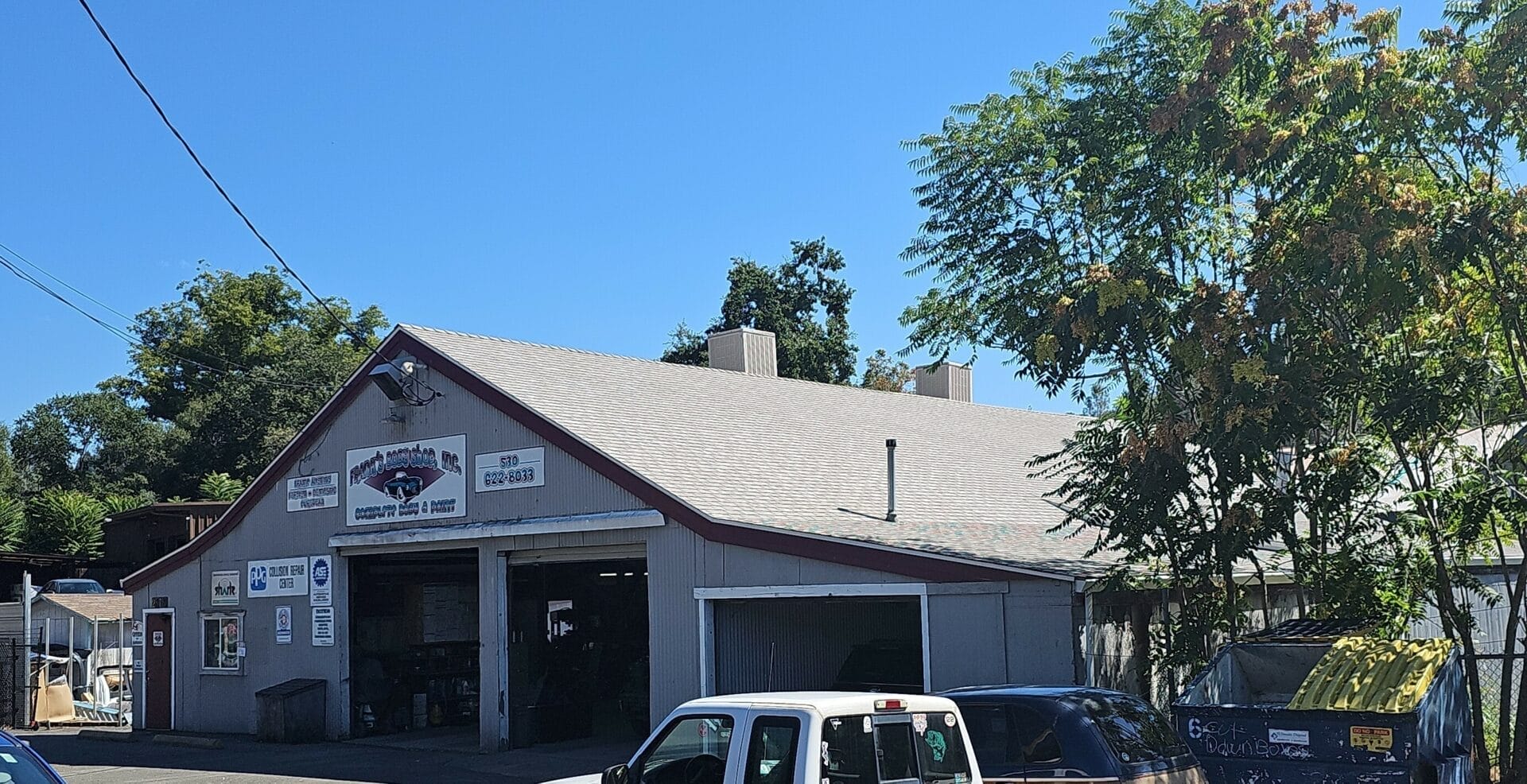 Gray commercial building with a triangle shaped roofing