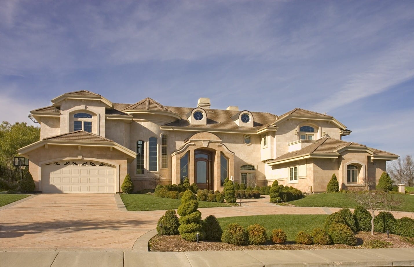 Freshly installed tile roof under a clear sky, highlighting craftsmanship by an experienced roofing contractor.