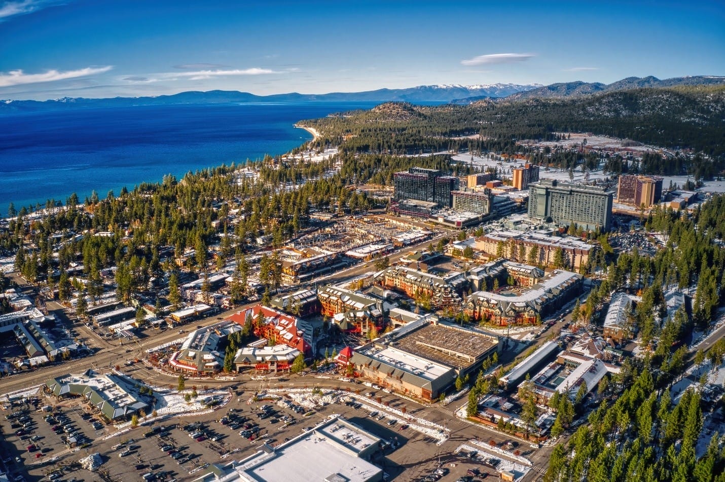 Aerial view of South Lake Tahoe showing commercial buildings and roads, related to commercial roof repair in the area.